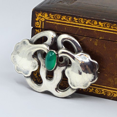 Bernhard Hertz; An Art Nouveau silver brooch with chrysoprase Bernhard Hertz; An Art Nouveau silver brooch with chrysoprase